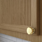 Baldwin Bevel Cabinet Knob 1-1/4" (4410) in Lifetime (PVD) Satin Brass shown on a cabinet door